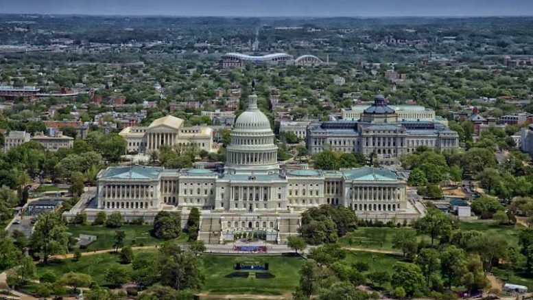 US Capitol building flanked by the Library of Congress and the Supreme Court