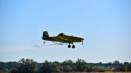 Airplane spraying crops