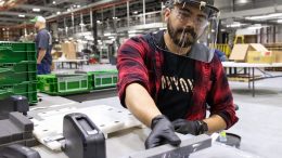 Jose Martinez, assembles protective face shields for health-care workers at the John Deere Seeding factory in Moline, Ill.